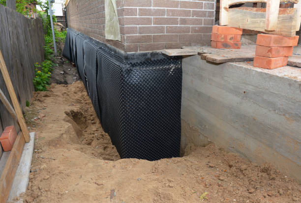 Happy homeowners after waterproofing job in Clyman